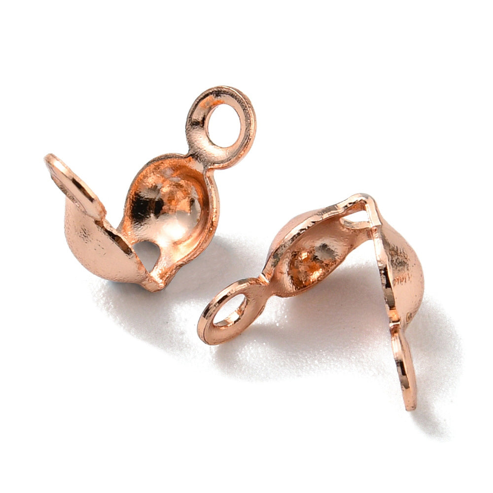 Brass Bead Tips, Rose Gold Plated Clamshell Knot Covers for DIY Jewelry Making.

Size: 8x4mm Hole:1.2mm, approx. 25pcs/pkg

Material: Brass Bead Tip Clamshell Covers, Rack Plating, Rose Gold color Calotte Ends.