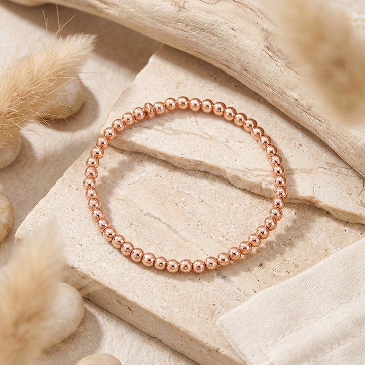 Delicate rose gold hematite stacking bracelet crafted with 4mm gemstone beads. Perfect companion to our beaded gemstone bracelet collection, this minimalist piece layers beautifully for a modern, effortless look.