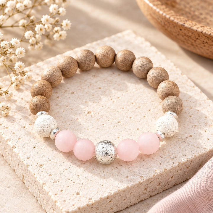 Chunky BOHO Beaded Bracelet - Hand-strung with 10mm frosted rose quartz, white and silver lava stone, burlywood wooden beads, and hematite rondelles for grounding energy. Rose quartz brings gentle, soothing vibes while lava beads anchor mental clarity and stability. The blend of soft pink, earthy neutrals, and silver accents creates a versatile piece that stacks beautifully or stands alone for everyday elegance.
