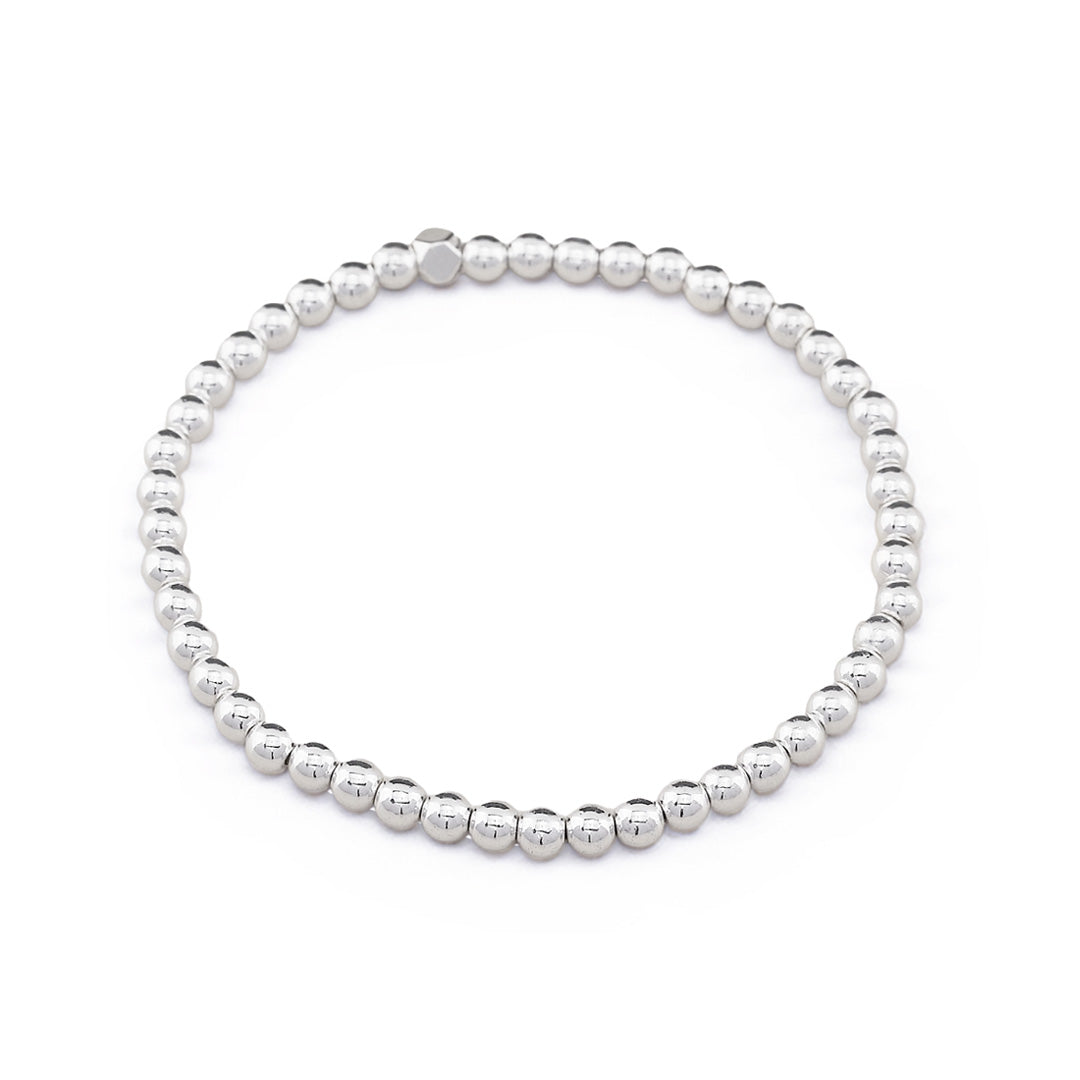 Delicate silver hematite stacking bracelet crafted with 4mm gemstone beads. Perfect companion to our beaded gemstone bracelet collection, this minimalist piece layers beautifully for a modern, effortless look. 