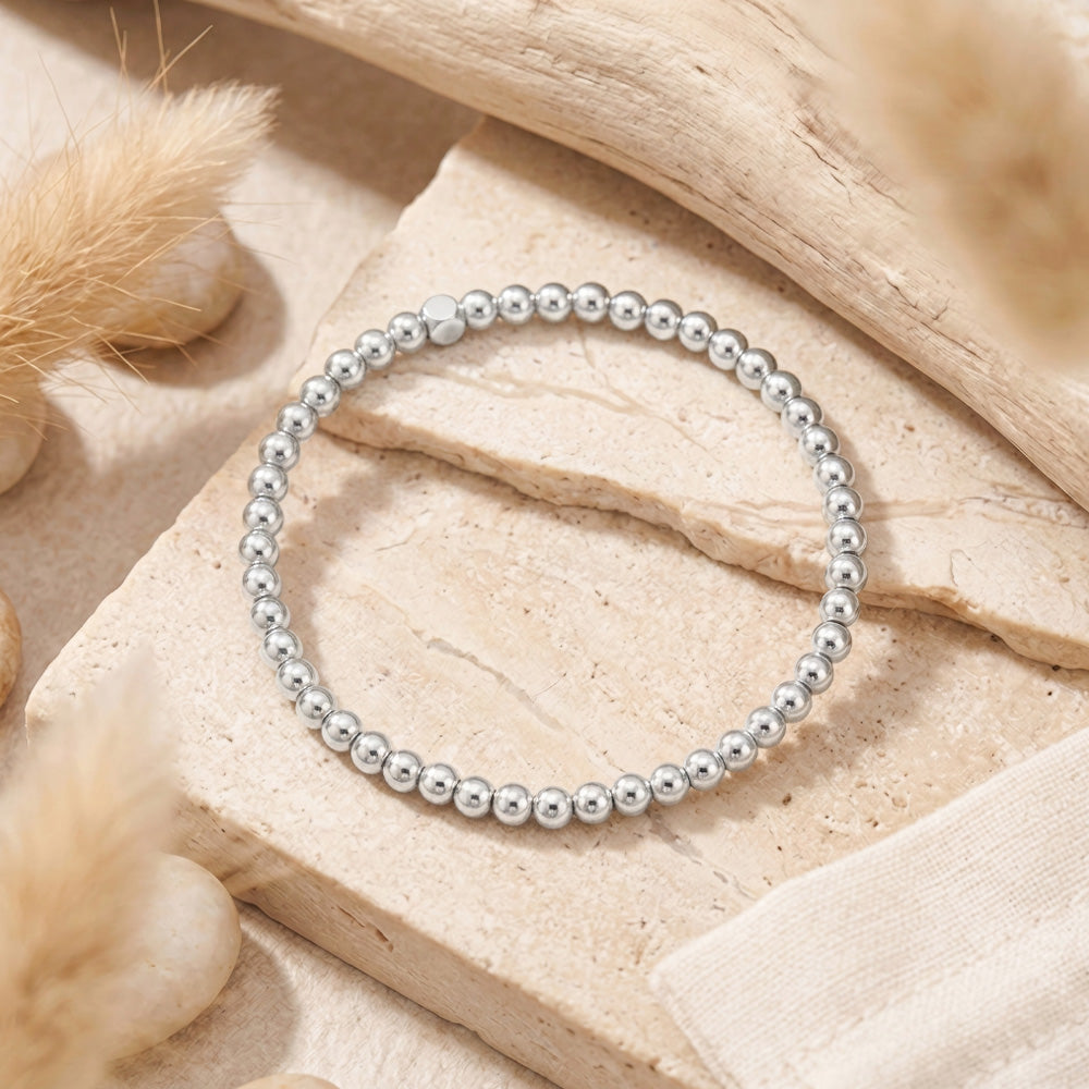 Delicate silver hematite stacking bracelet crafted with 4mm gemstone beads. Perfect companion to our beaded gemstone bracelet collection, this minimalist piece layers beautifully for a modern, effortless look. 