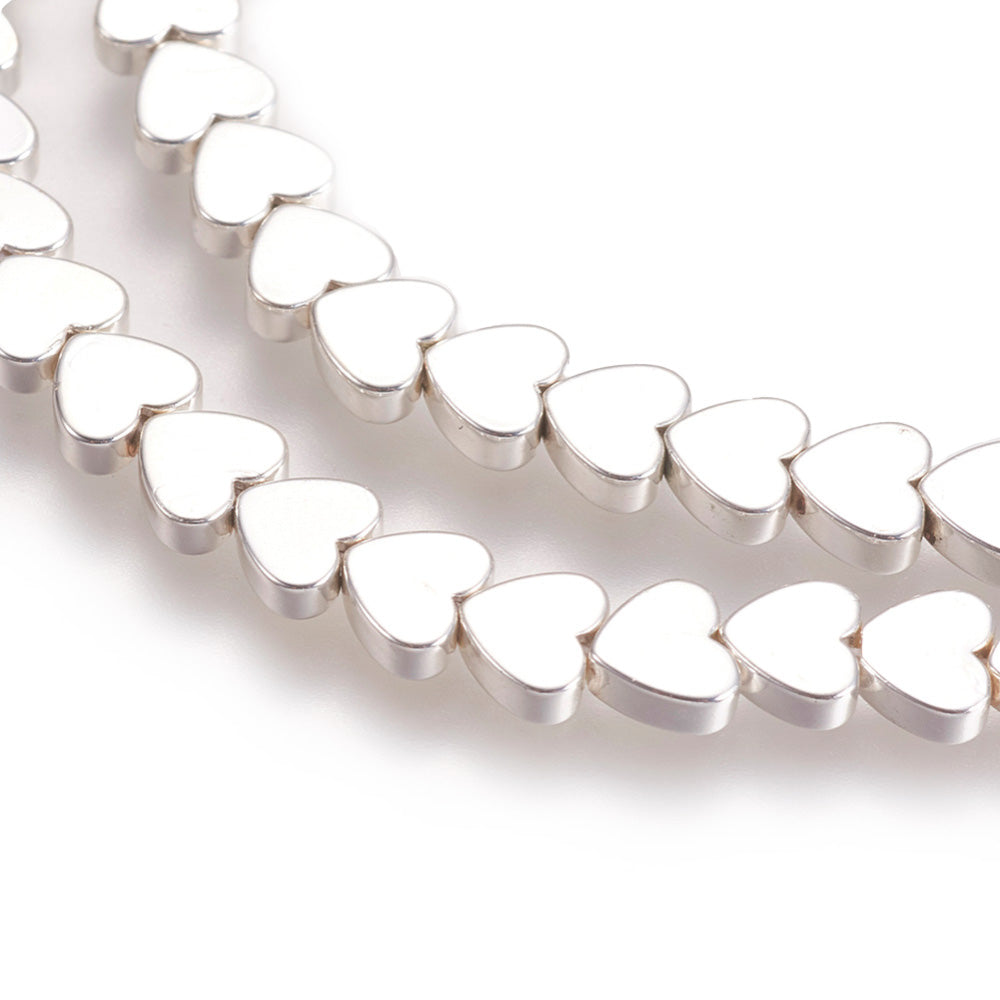 Silver Plated Non-Magnetic Synthetic Hematite Heart Beads for Jewelry Making.   Size: 6mm Length, 5mm Width, 2mm Thick, Hole: 1mm, approx. 80-83pcs/strand, 15.5" Inches Long.