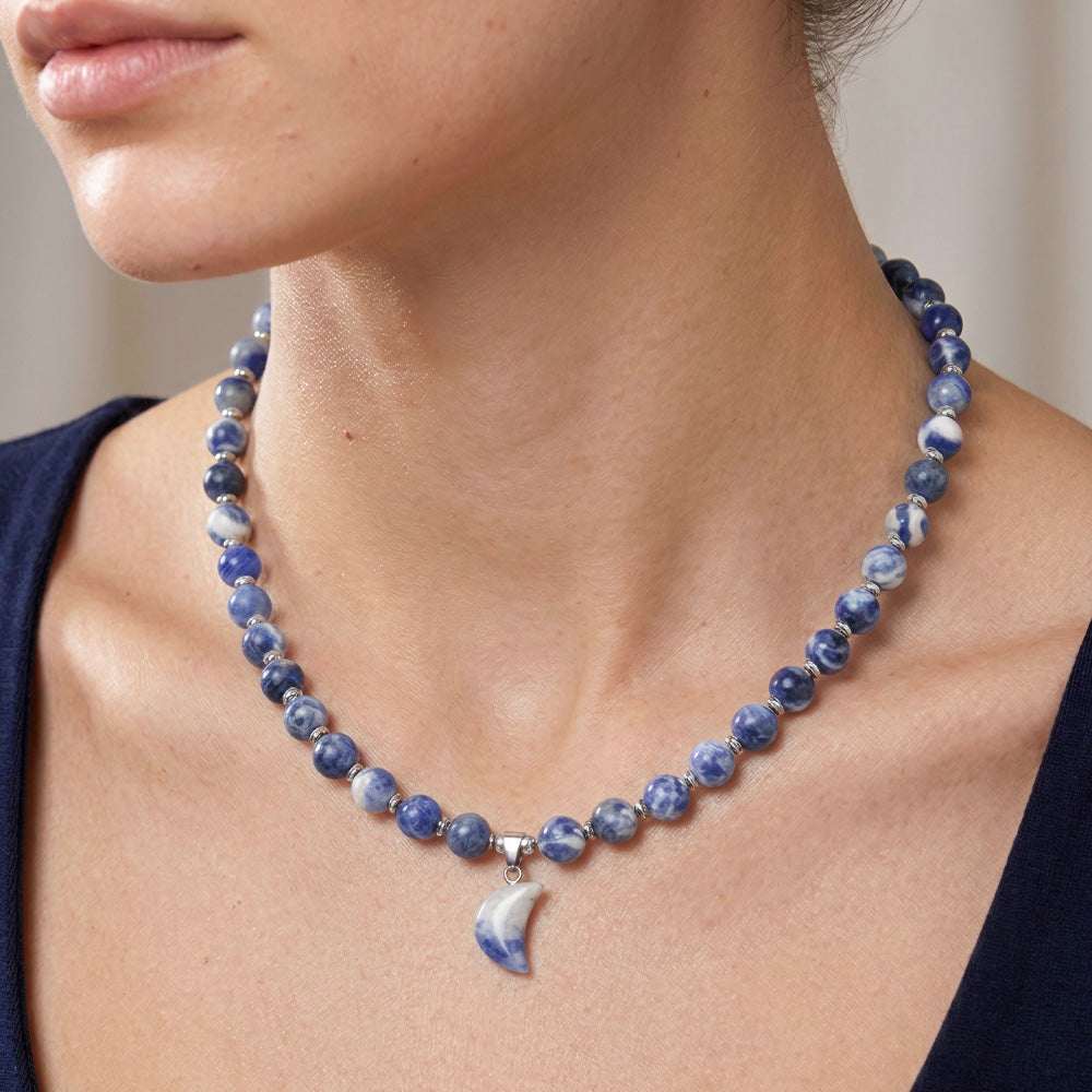 This Beaded Gemstone Necklace is a combination of Sodalite Beads and Blue Spot Jasper Pendant which stands out beautifully against the platinum-hued Stainless Steel spacers. Make a style statement with this unique, handcrafted necklace!