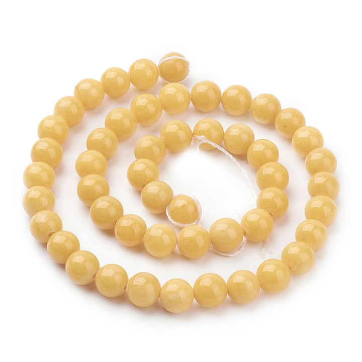 Yellow Jade Beads, round opaque yellow gemstone beads; perfect for jewelry making.   Sizes:  8mm Diameter, Hole: 1mm; approx. 48pcs/strand, 15" inches long.  6mm Diameter, Hole: 1mm; approx. 68pcs/strand, 15" inches long.  4mm Diameter, Hole: 1mm; approx. 91pcs/strand, 15" inches long.  Material: The Beads are Mashan Jade, Dyed Yellow Jade Beads. Polished Finish.  