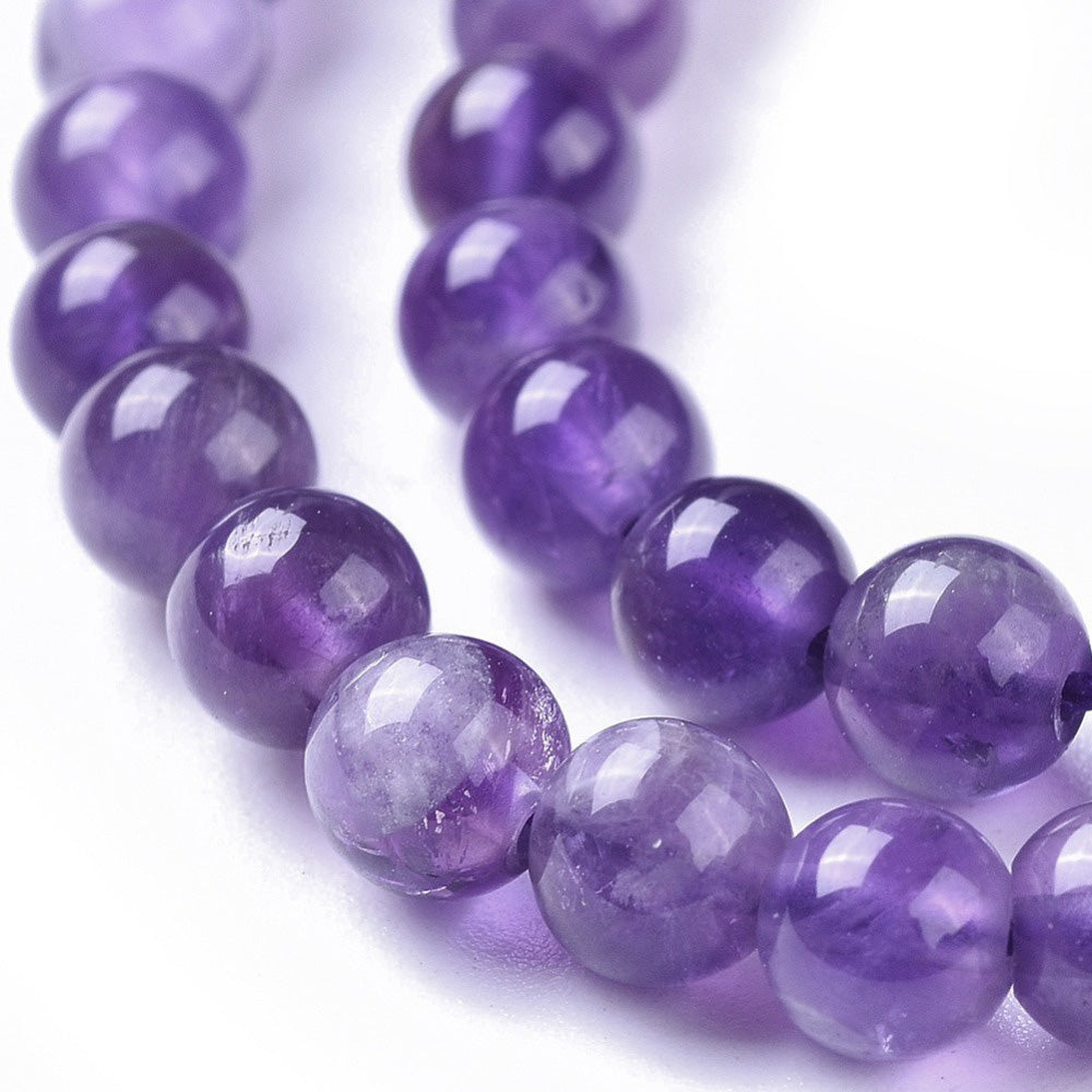 Gorgeous Amethyst Crystal Beads, Round, Purple Color. Semi-Precious Gemstone Beads for DIY Jewelry Making. Gorgeous, High Quality Crystal Beads.  Size: 4mm Diameter, Hole: 0.6mm; approx. 85pcs/strand, 14.5" Inches Long.  Material: Genuine Natural Amethyst Beads, High Quality Crystal Beads. Purple Color. Polished, Shinny Finish.  bead lot