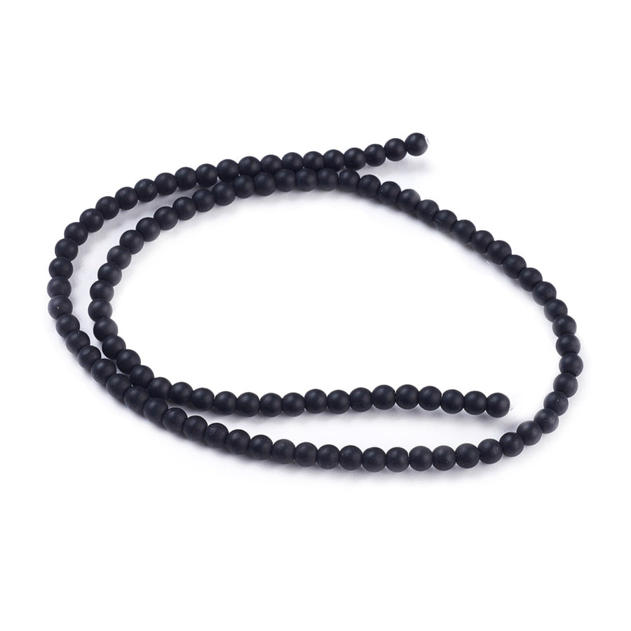 Synthetic Black Stone Beads, Round, Matte Black Color. Affordable Stone beads.  Size: 4-4.5mm Diameter, Hole: 1mm; approx. 92pcs/strand, 15" Inches Long.  Material: Synthetic Frosted Black Stone Beads. Black Color. Unpolished, Matte Finish. 