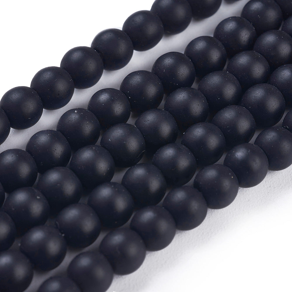 Synthetic Black Stone Beads, Round, Matte Black Color. Affordable Stone beads.  Size: 4-4.5mm Diameter, Hole: 1mm; approx. 92pcs/strand, 15" Inches Long.  Material: Synthetic Frosted Black Stone Beads. Black Color. Unpolished, Matte Finish. 