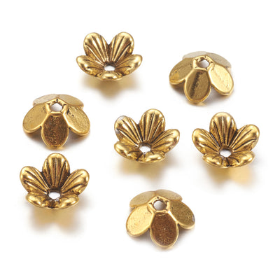 5 Petal Alloy Flower Spacer Beads. Flower Shaped Bead Caps, Gold Color. Flower Spacers for DIY Jewelry Making Projects.   Size: 9mm Diameter, 3mm Thick, Hole: 1.5mm, approx. 20pcs/package.  Material: Alloy 5 Petal Flower Bead Caps. Antique Gold Color. Lead, Cadmium & Nickel Free.