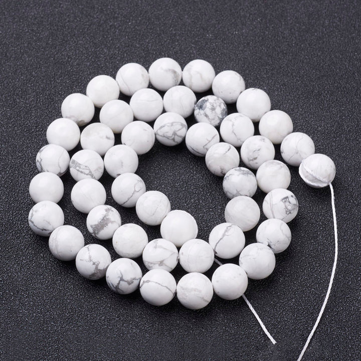 Natural White Howlite Beads Strands, Round. Semi-precious Gemstone Howlite Beads for DIY Jewelry Making.  High Quality Beads for Making Mala Bracelets and Necklaces. Size: 6mm in diameter, hole: 0.8mm, approx. 60pcs/strand, 15" Inches Long.