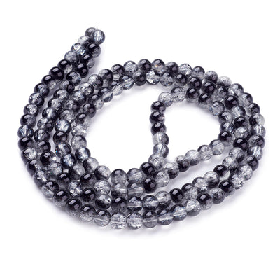Popular Crackle Glass Beads, Round, Black and Clear Color. Glass Bead Strands for DIY Jewelry Making. Affordable, Colorful Crackle Beads. Great for Stretch Bracelets.  Size: 6mm Diameter Hole: 1.3mm; approx. 128pcs/strand, 31" Inches Long  Material: The Beads are Made from Glass. Crackle Glass Beads, Black Colored Beads with Clear Markings.  Polished, Shinny Finish.