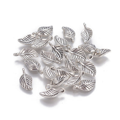 Leaf Charm Beads, Silver Colored Charms for DIY Jewelry Making. Charms for Bracelet and Necklace Making.  Size: 7.5mm Width, 14.5mm Length, 4mm Thick, Hole: 2mm, Quantity: 10 pcs/bag.   Material: Alloy Charms. Antique Silver Color. Polished Shinny Finish.