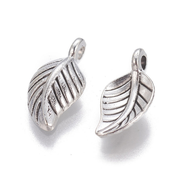 Leaf Charm Beads, Silver Colored Charms for DIY Jewelry Making. Charms for Bracelet and Necklace Making.  Size: 7.5mm Width, 14.5mm Length, 4mm Thick, Hole: 2mm, Quantity: 10 pcs/bag.   Material: Alloy Charms. Antique Silver Color. Polished Shinny Finish.