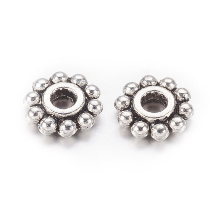 Alloy Daisy Spacer Beads, Flower, Antique Silver Color. Flower Shaped Alloy Spacers for DIY Jewelry Making Projects.  Size: 6-6.5mm Diameter, Hole: 1mm, approx. 50 pcs/package.  Material: Tibetan Alloy Daisy Spacers. Antique Silver Color Plated Flower Spacers. Lead and Nickel Free.