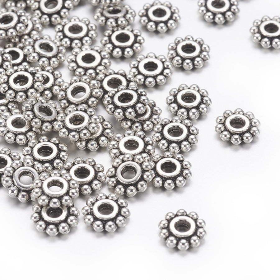 Alloy Daisy Spacer Beads, Flower, Antique Silver Color. Flower Shaped Alloy Spacers for DIY Jewelry Making Projects.  Size: 6-6.5mm Diameter, Hole: 1mm, approx. 50 pcs/package.  Material: Tibetan Alloy Daisy Spacers. Antique Silver Color Plated Flower Spacers. Lead and Nickel Free.