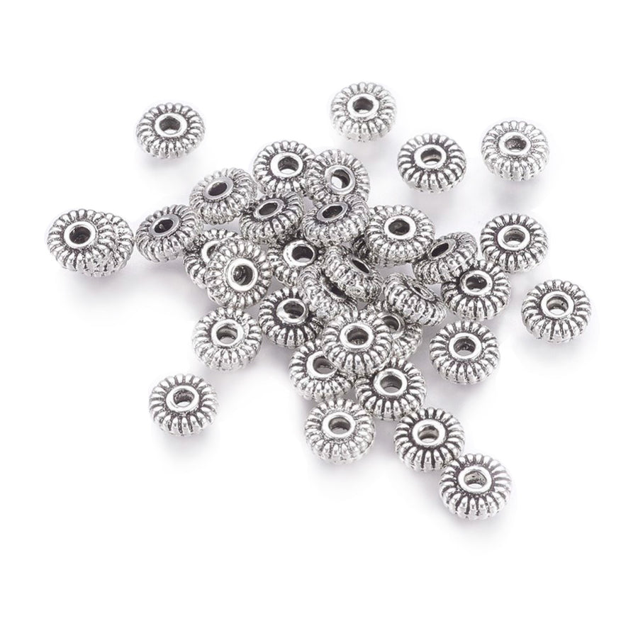 Tibetan Flat Round Spacer Beads, Antique Silver Color. Silver Spacers for DIY Jewelry Making Projects. High Quality, Classy, Non-Tarnish Spacers for Beading Projects.  Size: 5mm Wide, 1.5mm Thick, Hole: 1.5mm, approx. 25pcs/bag.   Material:  Antique Silver Tibetan Style, Shinny Finish. Cadmium, Lead and Nickel Free Spacers.