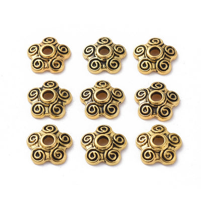 Five Petal Alloy Flower Spacer Beads. Flower Shaped Bead Caps, Gold Color. Flower Spacers for DIY Jewelry Making Projects.   Size: 10mm Diameter, 3mm Thick, Hole: 2mm, approx. 25pcs/package.  Material: Alloy Flower Bead Caps. Antique Gold Color. Cadmium, Lead and Nickel Free.