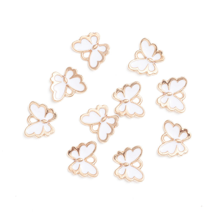 Gold Plated Alloy Charm. White Enamel Butterfly Charms for DIY Jewelry Making.  Size: 10mm Length, 13mm Width, 2mm Thick, Hole: 1mm, Quantity: 10 pcs/package.  Material: Alloy (Lead and Nickel Free) Charms. Light Gold Plated with White Enamel.