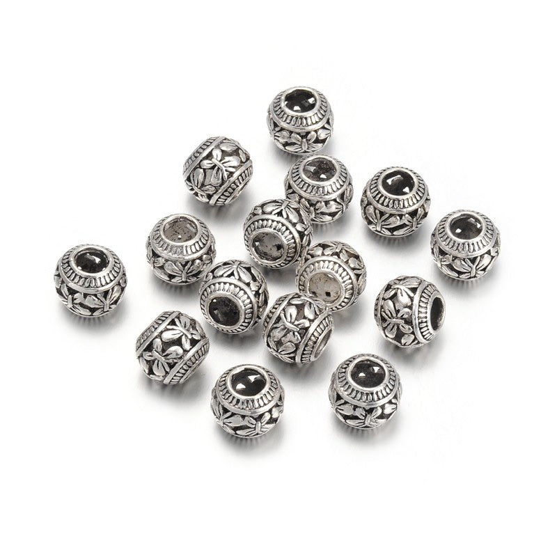 Large Hole European Metal Spacer Beads, Alloy Beads with Butterfly Design, Silver Color, Round Rondelle Shape for DIY Jewelry Making.   Size: 11mm Diameter, 9mm Thick, Hole: 4.5mm, Quantity: 5pcs/package.  Material: Alloy European Large Hole Beads. Antique Silver Color with a Butterfly Pattern.