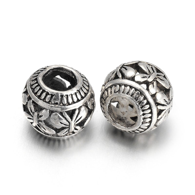 Large Hole European Metal Spacer Beads, Alloy Beads with Butterfly Design, Silver Color, Round Rondelle Shape for DIY Jewelry Making.   Size: 11mm Diameter, 9mm Thick, Hole: 4.5mm, Quantity: 5pcs/package.  Material: Alloy European Large Hole Beads. Antique Silver Color with a Butterfly Pattern.