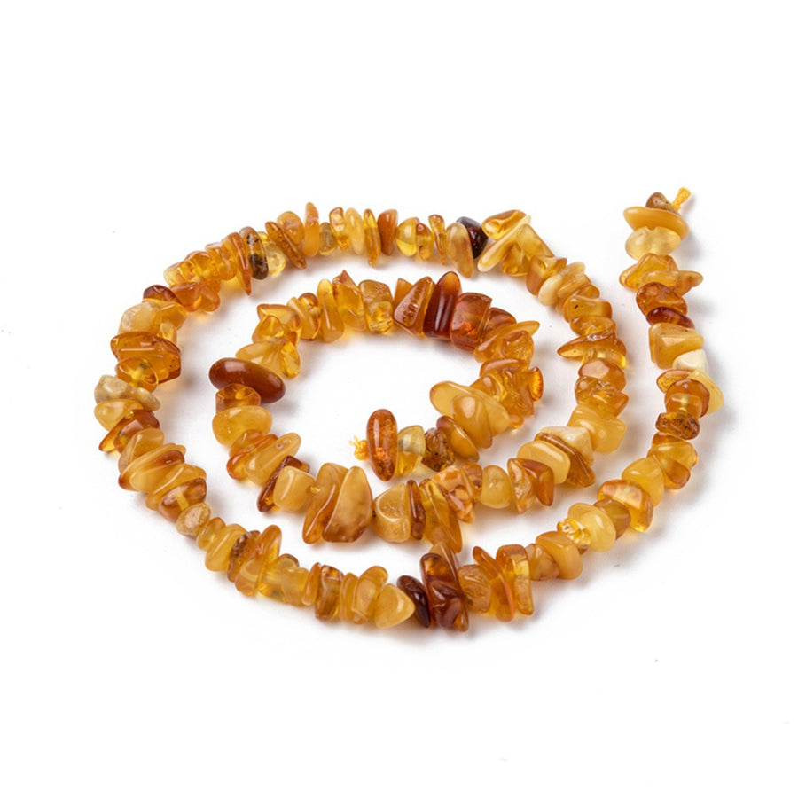 Amber Chip Beads, Semi-Precious Stone Chips Beads for Jewelry Making.  Size: 5~14mm wide, 4~10mm long, Hole: 1mm; approx. 15 inches long.  Material: Genuine Natural Amber Stone Chip Beads. 