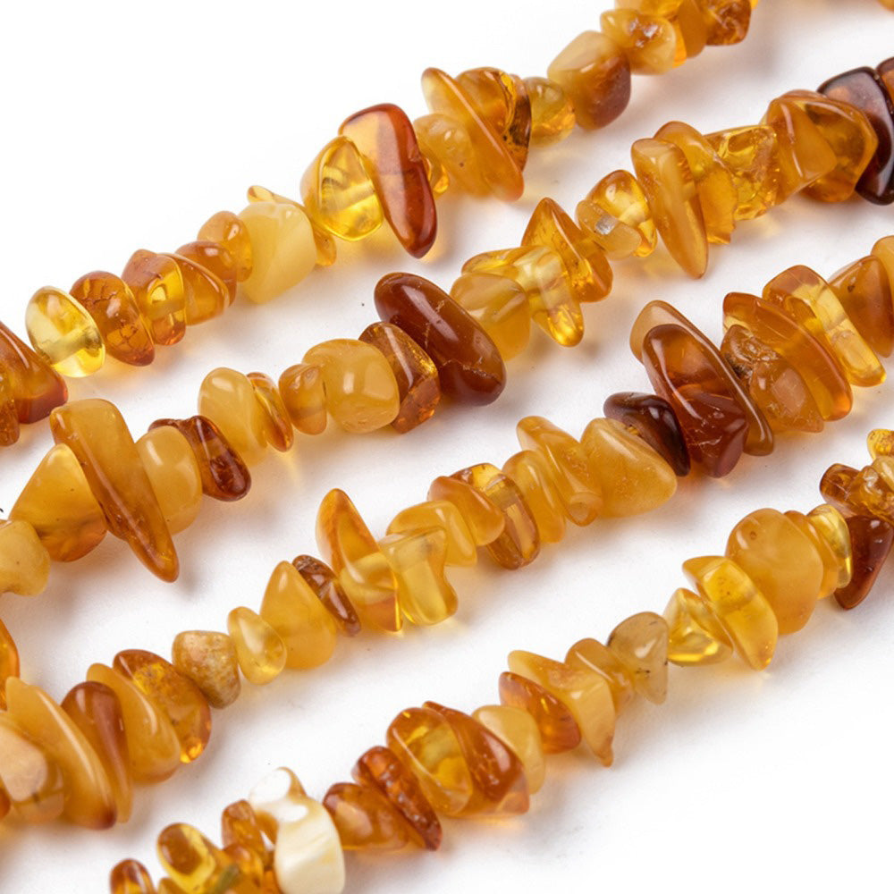 Amber Chip Beads, Semi-Precious Stone Chips Beads for Jewelry Making.  Size: 5~14mm wide, 4~10mm long, Hole: 1mm; approx. 15 inches long.  Material: Genuine Natural Amber Stone Chip Beads. 