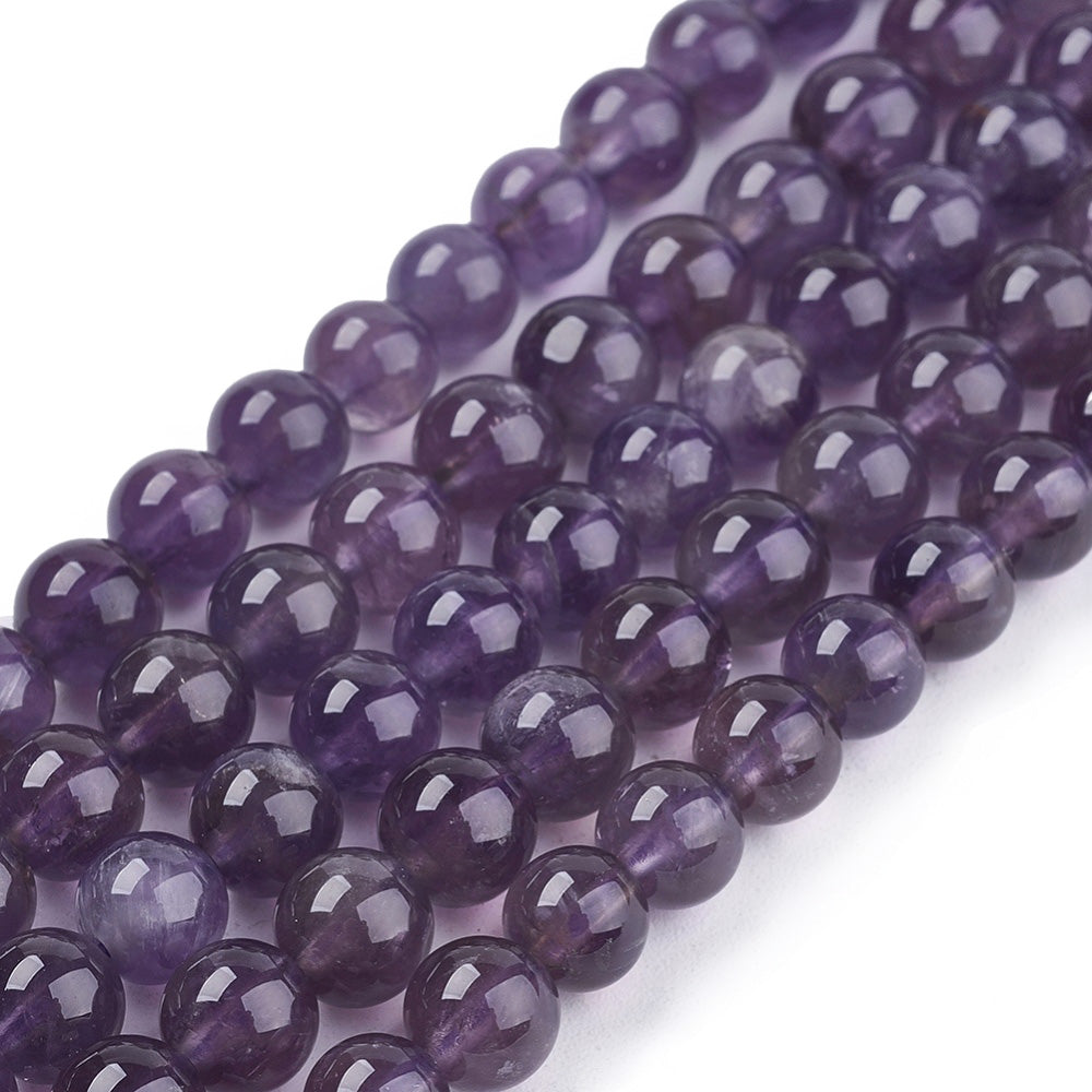 Natural Amethyst Crystal Beads, Round, Purple Color. Semi-Precious Gemstone Beads for DIY Jewelry Making. Gorgeous, High Quality Crystal Beads.  Size: 6mm Diameter, Hole: 1mm; approx. 64pcs/strand, 15" Inches Long.  Material: Genuine Natural Amethyst Beads, Quality Crystal Beads. Dark Purple Color. Polished, Shinny Finish.   Amethyst Properties: Amethyst is the Symbol of Peace, Cleansing and Calming Energy.