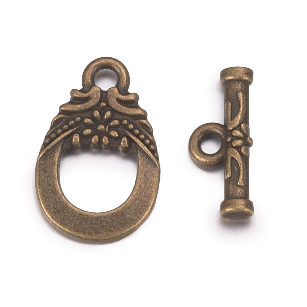 Antique Bronze Teardrop Shaped Toggle Clasps for DIY Jewelry Making. Unique Toggle Clasp.  Size: 19mm Length, 11mm Width; Bar: 5x30mm, Hole: 2mm, 4 set/package.  Material: Bronze Color Alloy Toggle Clasps, Teardrop shape. Cadmium, Nickel and Lead Free.   Usage: These Clasp are used to finish off jewelry. Add a unique touch to your jewelry designs.