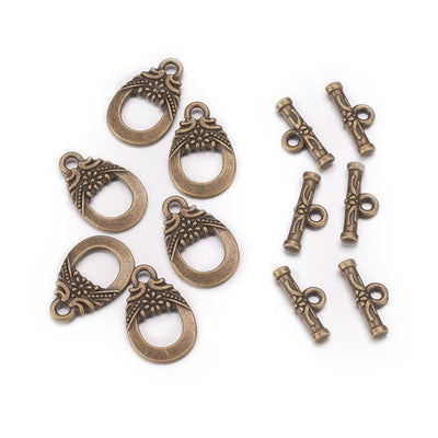 Antique Bronze Teardrop Shaped Toggle Clasps for DIY Jewelry Making. Unique Toggle Clasp.  Size: 19mm Length, 11mm Width; Bar: 5x30mm, Hole: 2mm, 4 set/package.  Material: Bronze Color Alloy Toggle Clasps, Teardrop shape. Cadmium, Nickel and Lead Free.   Usage: These Clasp are used to finish off jewelry. Add a unique touch to your jewelry designs