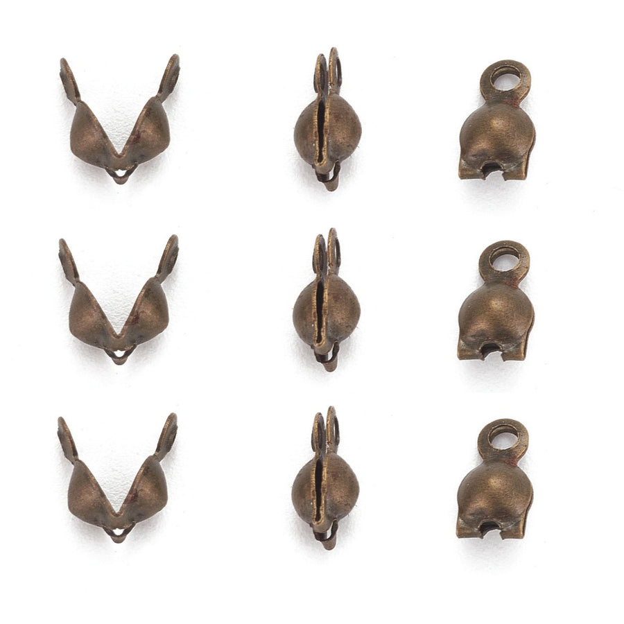 Antique Bronze Color Iron Bead Tips, Bronze Color Clamshell Knot Covers for DIY Jewelry Making.  Size: 7mm Length, 4mm Diameter, approx. 25pcs/pkg  Material: Iron Bead Tip Clamshell Covers, Antique Bronze color Calotte Ends.  Usage: Clamshell Bead Tips are used to conceal knots where thread and metal jewelry findings meet. Used for finishing Jewelry Ends.