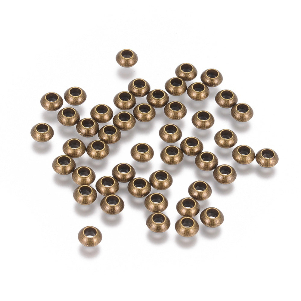 Antique Bronze Colored Spacer Beads, Rondelle shaped Spacers for DIY Jewelry Making.   Size: 5.5mm Diameter, Hole: 2.8mm, approx. 25pcs/bag.   Material: Antique Bronze Metal Alloy Spacer Beads. 100% Lead, Cadmium & Nickel Free Spacers.