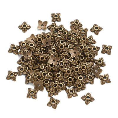 Alloy Flower Spacer Beads. Flower Shaped Bead Caps, Bonze Color. Flower Spacers for DIY Jewelry Making Projects.   Size: 6mm Diameter, 2mm Thick, Hole: 1mm, approx. 10pcs/package.  Material: Alloy Flower Bead Caps. Antique Bronze Color. Lead and Nickel Free.