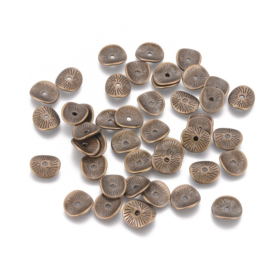 Wavy Arched Disc Spacer Beads, Antique Bronze Jewelry Findings for DIY Jewelry Making Projects.   Size: 9mm Wide, 1mm Thick, Hole: 1mm, approx. 25pcs/bag.   Material: Antique Bronze Alloy, (Lead, Nickel and Cadmium free).  Usage: These Spacer Beads are Suitable for Necklaces, Earrings, Bracelets, and other Creative Projects. Metal Findings for DIY Crafting and Jewelry Making.