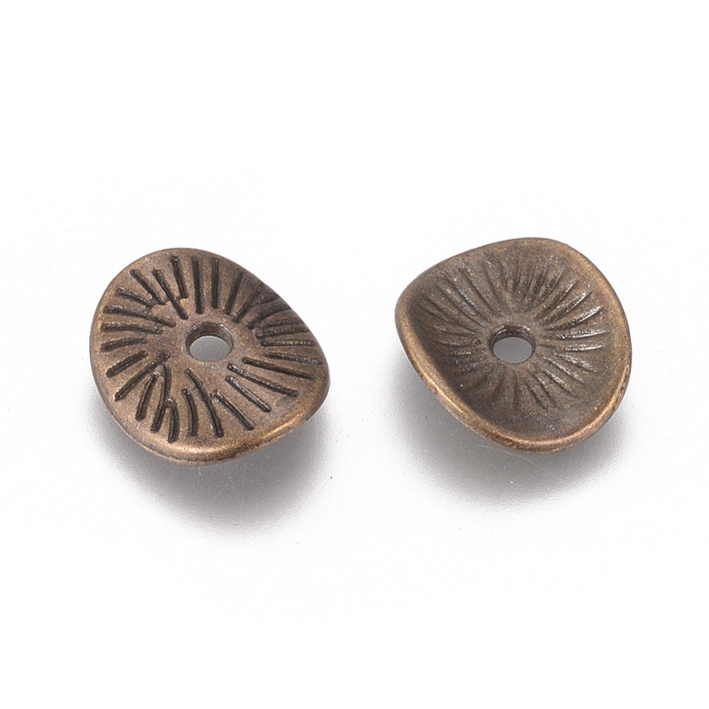 Wavy Arched Disc Spacer Beads, Antique Bronze Jewelry Findings for DIY Jewelry Making Projects.   Size: 9mm Wide, 1mm Thick, Hole: 1mm, approx. 25pcs/bag.   Material: Antique Bronze Alloy, (Lead, Nickel and Cadmium free).  Usage: These Spacer Beads are Suitable for Necklaces, Earrings, Bracelets, and other Creative Projects. Metal Findings for DIY Crafting and Jewelry Making.