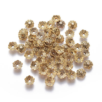 5 Petal Alloy Flower Spacer Beads. Flower Shaped Bead Caps, Antique Gold Color. Flower Spacers for DIY Jewelry Making Projects.   Size: 8mm Diameter, 2.5mm Thick, Hole: 2mm, approx. 25pcs/package.  Material: Alloy Flower Bead Caps. Antique Gold Color. Lead, Cadmium and Nickel Free.