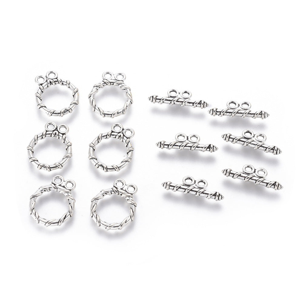 Tibetan Toggle Ring Clasp for DIY Jewelry Making. Antique Silver Color with Design, Round Clasps.  Size: Ring: 18x15mm, Bar: 20x2mm, Hole: 2mm, 5 set/package.  Material: Alloy Toggle Clasps, Cadmium, Nickel and Lead Free, Antique Silver Color Clasp. 