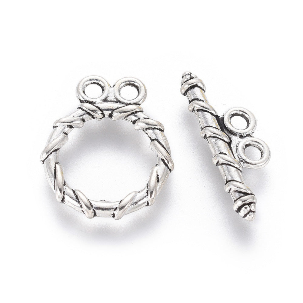 Tibetan Toggle Ring Clasp for DIY Jewelry Making. Antique Silver Color with Design, Round Clasps.  Size: Ring: 18x15mm, Bar: 20x2mm, Hole: 2mm, 5 set/package.  Material: Alloy Toggle Clasps, Cadmium, Nickel and Lead Free, Antique Silver Color Clasp. 