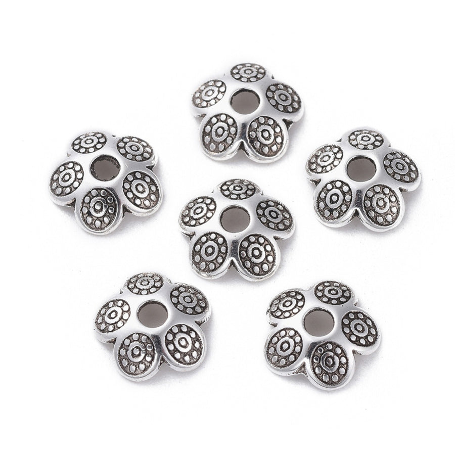 Antique Silver Bead Caps, Alloy Flower Spacer Beads. Flower Shaped Bead Caps, Silver Color. Flower Spacers for DIY Jewelry Making Projects.   Size: 8mm Diameter, 2mm Thick, Hole: 2mm, approx. 25pcs/package  Material: Alloy Flower Bead Caps. Antique Silver Color. Lead, Cadmium and Nickel Free.