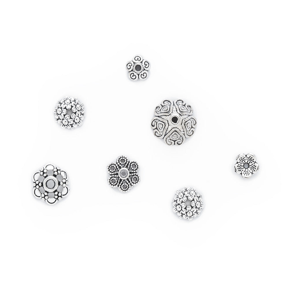 Mixed Shape Bead Cap, Cones and Spacer Beads. Antique Silver Color Bead Caps and Bead Spacers for DIY Jewelry Making Projects.   Size: Mixed Size ranges from 5-20x2-10mm, approx. 75pcs/package  Material: Alloy Flower Bead Caps. Silver Color. Lead, Cadmium and Nickel Free.