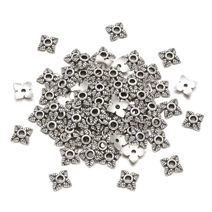 Alloy Flower Spacer Beads. Flower Shaped Bead Caps, Silver Color. Flower Spacers for DIY Jewelry Making Projects.   Size: 6mm Diameter, 2mm Thick, Hole: 1mm, approx. 20pcs/package.  Material: Alloy Flower Bead Caps. Shinny Antique Silver Color. Lead and Nickel Free.