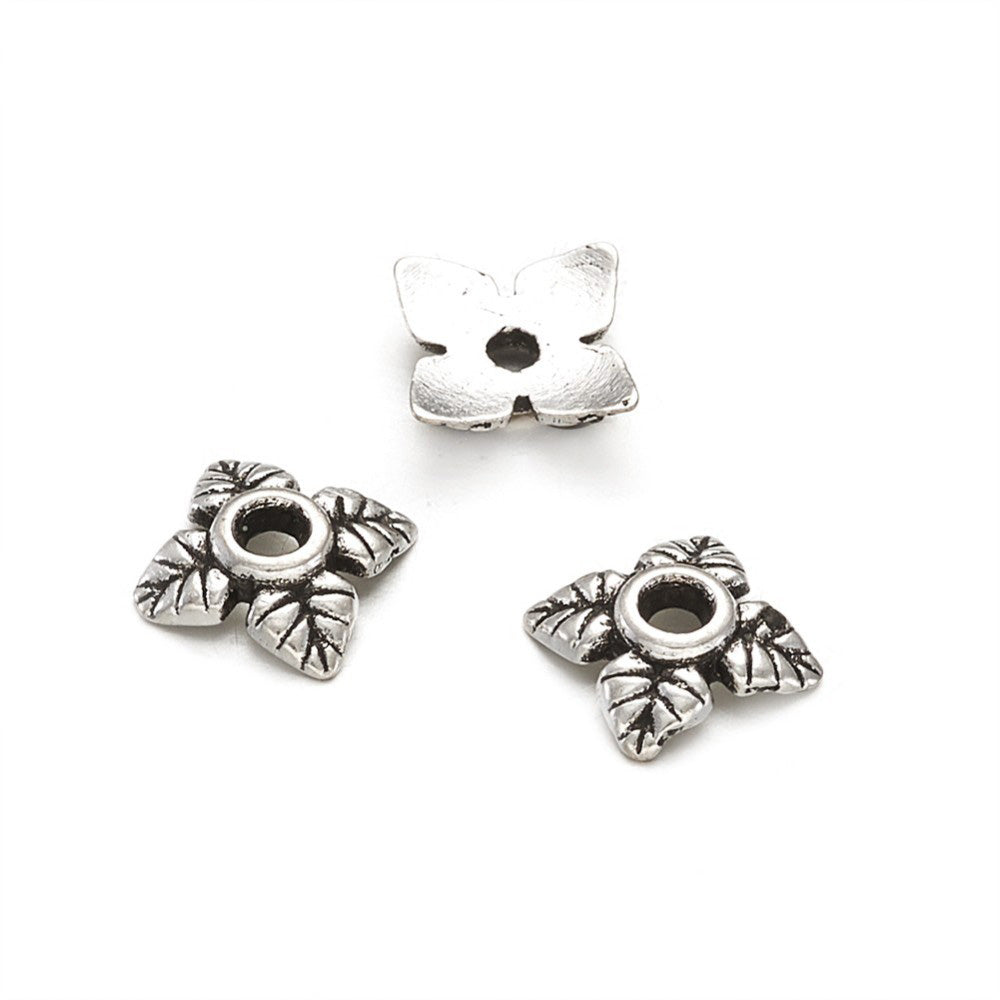Alloy Flower Spacer Beads. Flower Shaped Bead Caps, Silver Color. Flower Spacers for DIY Jewelry Making Projects.   Size: 6mm Diameter, 2mm Thick, Hole: 1mm, approx. 20pcs/package.  Material: Alloy Flower Bead Caps. Shinny Antique Silver Color. Lead and Nickel Free.
