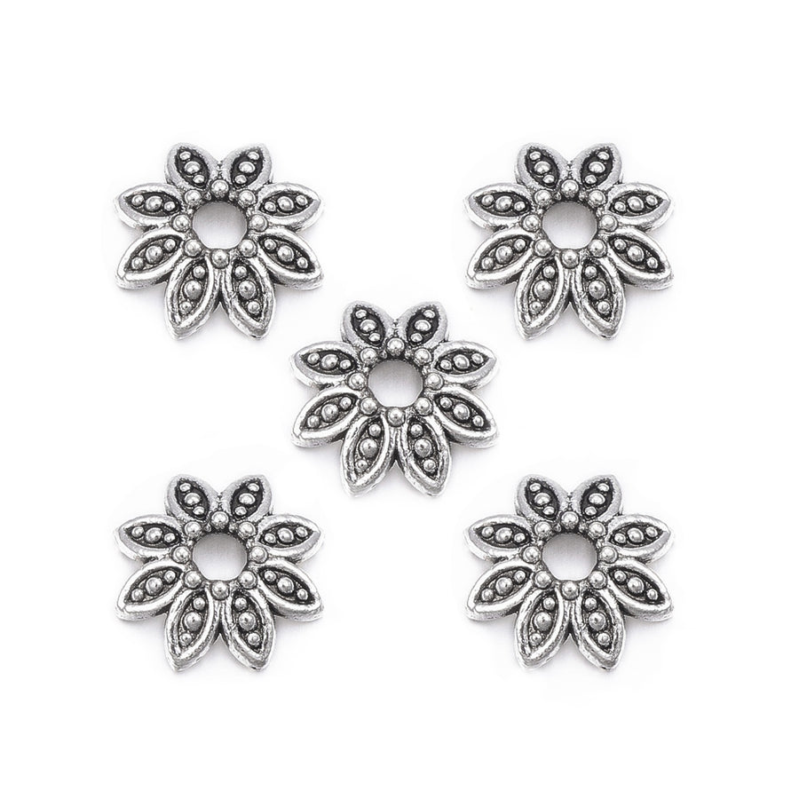 Multi Petal Alloy Flower Spacer Beads. Flower Shaped Bead Caps, Silver Color. Flower Spacers for DIY Jewelry Making Projects.   Size: 10mm Diameter, 2.5mm Thick, Hole: 1.5mm, approx. 25pcs/package.  Material: Alloy Multi Petal Flower Bead Caps. Antique Silver Color. Lead, Cadmium & Nickel Free.