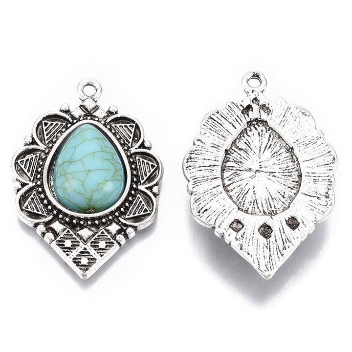 Antique Silver Synthetic Turquoise Gemstone Pendants, Turquoise Color. Teardrop Pendant for DIY Jewelry Making. Great for Necklaces.   Size: 36mm Length, 24mm Wide, 6mm Thick, Hole: 1.8mm, 1pcs/package.   Material: Synthetic Turquoise Stone Pendant, Antique Silver Plated Alloy Pendant. Tear Drop shaped Pendants. Shinny, Polished Finish. 