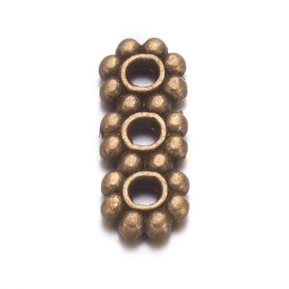 Spacer Bars, Flower, Antique Bronze Color. Spacer Bars for DIY Jewelry Making Projects.   Size: 10.5mm Length, 4.3mm Width, Hole: 1.5mm, approx. 20pcs/bag.   Material:  Antique Bronze Alloy Spacer Bar. Cadmium, Lead and Nickel Free Spacers.