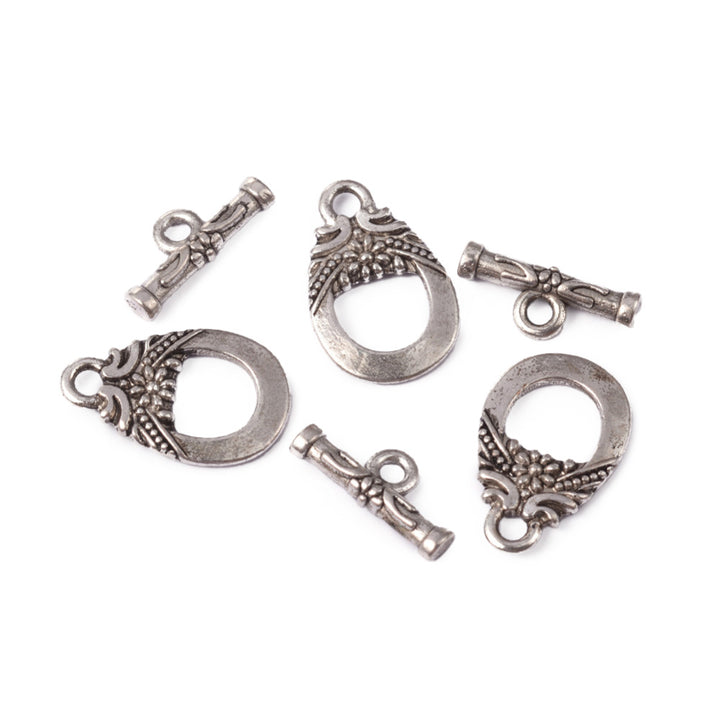 Antique Silver Teardrop Shaped Toggle Clasps for DIY Jewelry Making. Unique Toggle Clasp.  Size: 19mm Length, 11mm Width; Bar: 14x6mm, Hole: 2mm, 5 set/package.  Material: Silver Color Alloy Toggle Clasps, Teardrop shape. Cadmium, Nickel and Lead Free.   Usage: These Clasp are used to finish off jewelry. Add a unique touch to your jewelry designs.
