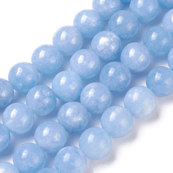 Stunning Aquamarine Natural Jade Beads, Round, Light Blue Color. Semi-Precious Crystal Gemstone Beads for Jewelry Making. Great for Stretch Bracelets. Size: 8mm in Diameter, Hole: 1mm; approx. 47pcs/strand, 14.75" Inches Long. Material: Imitation Aquamarine Beads made from Natural Jade dyed Blue Color. Polished, Shinny Finish. bead lot. beadlotcanada
