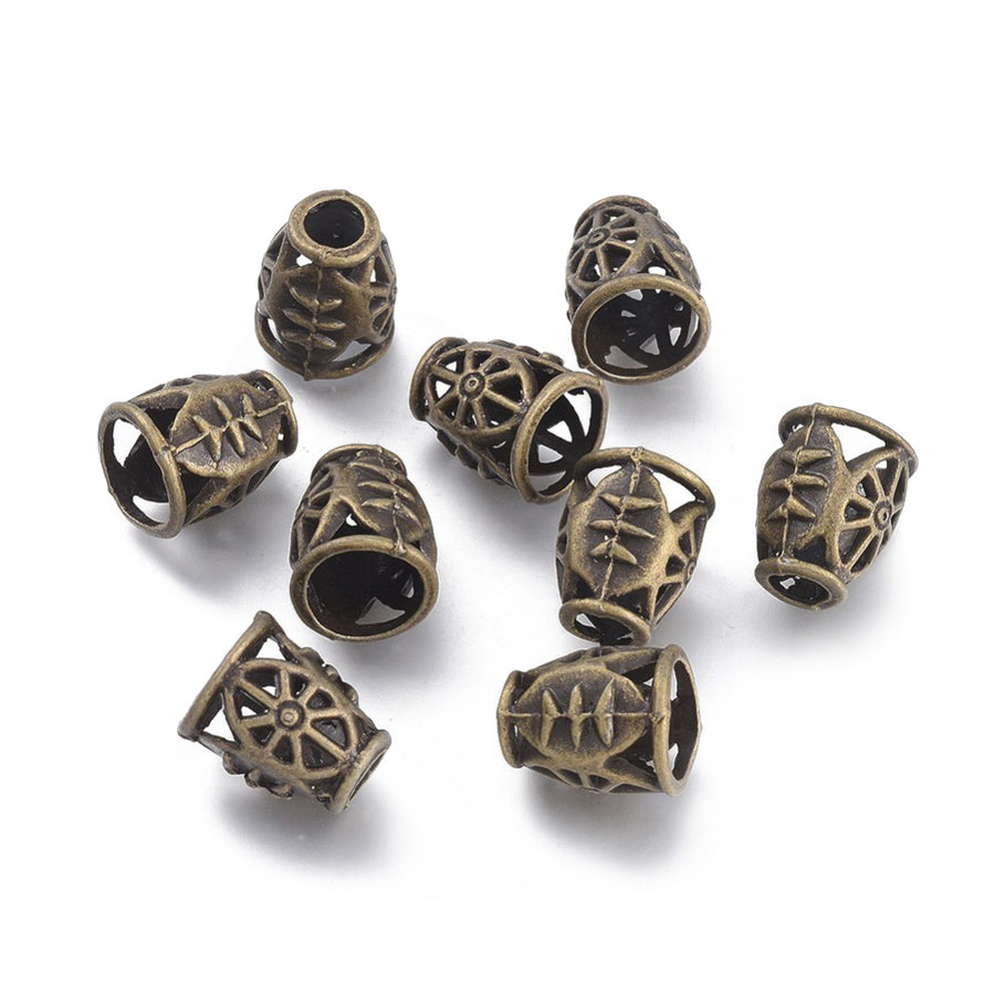 Antique Bronze Alloy Bead Cones. Cart Wheel Design Bead Caps, Bronze Color Bead Cones.   Size: 11.5mm Diameter, 14mm Length, 9mm inner diameter, Qty: 4pcs/package.  Material: Alloy Bead Cones. Antique Bronze Color. Lead, Cadmium and Nickel Free.