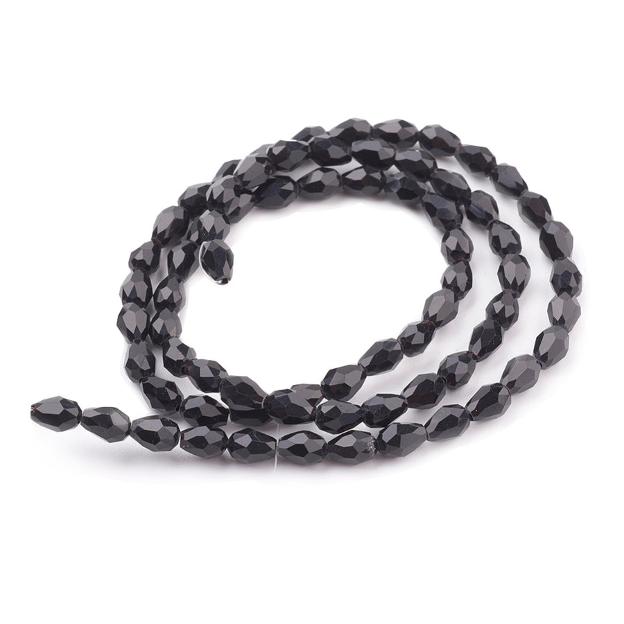 Teardrop Crystal Glass Beads, Faceted, Shinny Black Color, Glass Crystal Bead Strands. Shinny, Premium Quality Crystal Beads for Jewelry Making.  Size: 7mm Length, 5mm Thick, Hole: 1mm; approx. 72pcs/strand, 15" inches long.  Material: The Beads are Made from Glass. Glass Crystal Beads, Teardrop Shaped, Black Colored Beads. Polished, Shinny Finish.