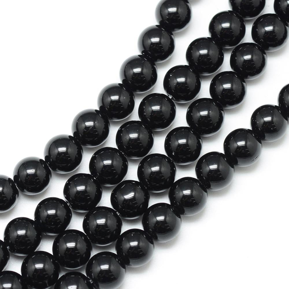 Synthetic Black Stone Beads, Round, Shinny Black Color. Affordable Stone beads.  Size: 6mm Diameter, Hole: 1mm; approx. 62pcs/strand, 15" Inches Long.  Material: Synthetic Black Stone Beads. Black Color. Polished, Shinny Finish. 