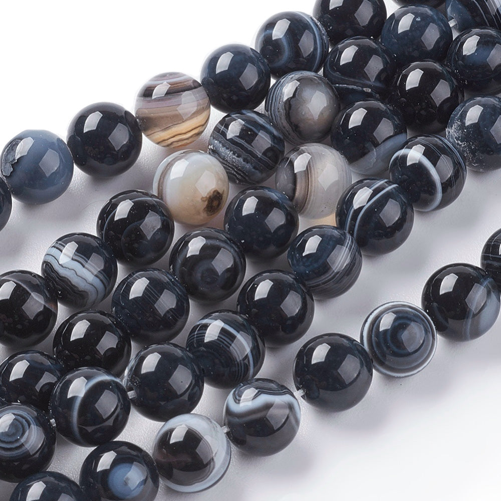 Black Striped Agate Beads, Round, Dyed, Black Agate.  Semi-Precious Gemstone Beads for Jewelry Making. Great for Stretch Bracelets and Necklaces.  Size: 8mm Diameter, Hole: 1mm; approx. 46pcs/strand, 14" Inches Long.  Material:  Striped Banded Agate Loose Beads Dyed Black Color. Polished, Shinny Finish.