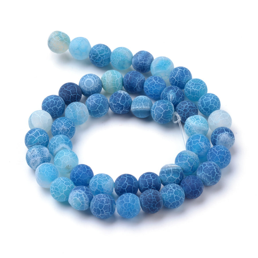 Natural Crackle Agate Beads, Dyed, Round, Blue Color. Matte Semi-Precious Gemstone Beads for Jewelry Making. Great for Stretch Bracelets and Necklaces.  Size: 6mm Diameter, Hole: 1.5mm; approx. 61pcs/strand, 14.5" Inches Long.  Material: Natural & Dyed Crackle Agate, Frosted Blue Color with White Crackle Pattern. The Crackle Appearance is Created by Heating the Stone to Extreme Temperatures. Unpolished, Matte Finish.